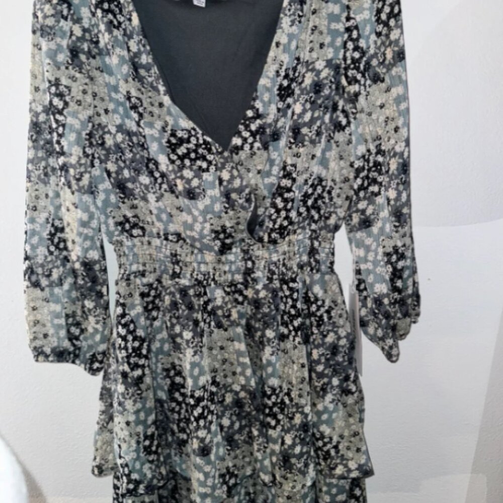 never worn. still has tags. has a little button to show less chest if wanted